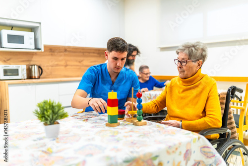 Obraz na płótnie Nurse assisting elderly woman with rehabilitation exercises in nursing home w salonie