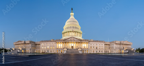 Panorama of the illuminated U.S. Capitol Building in Washington D.C. at dawn