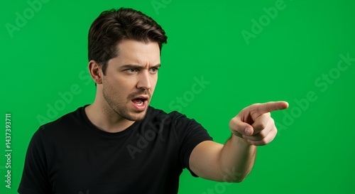 Angry Man Pointing Accusatory Finger Green Screen Studio Shot photo