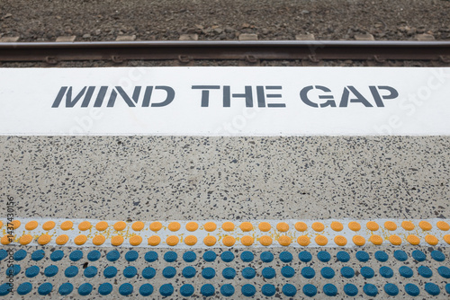 Mind the gap sign at a train station