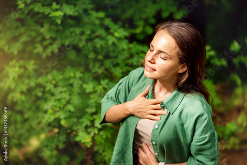 Tableau sur toile high angle view of young adult woman practising breathing exercise in the forest in summer