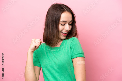 Young Ukrainian woman wearing a band aids celebrating a victory