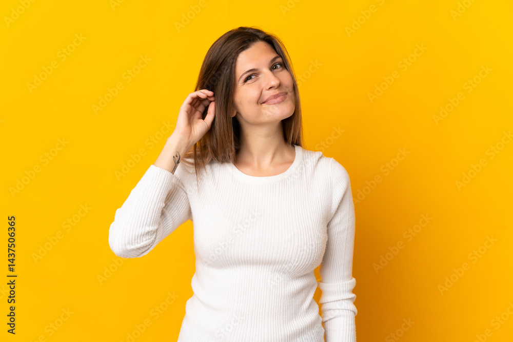 Young Slovak woman isolated on yellow background having doubts Young Slovak woman isolated on yellow background having doubts