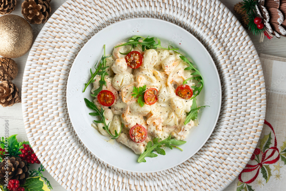 Italian gnocchi salad with cream and arugula. Top view table with christmas decoration. Italian gnocchi salad with cream and arugula. Top view table with christmas decoration.