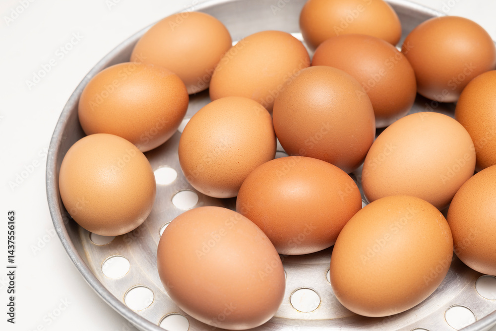 Fresh Chicken Eggs Arranged in a Steamer Basket Ready for Cooking Fresh Chicken Eggs Arranged in a Steamer Basket Ready for Cooking