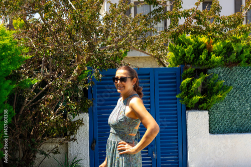portrait of beautiful young woman in sunglasses in the garden	