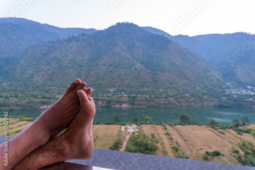 Photography Relaxing Feet on Hotel Balcony with Himalayan Mountains and River