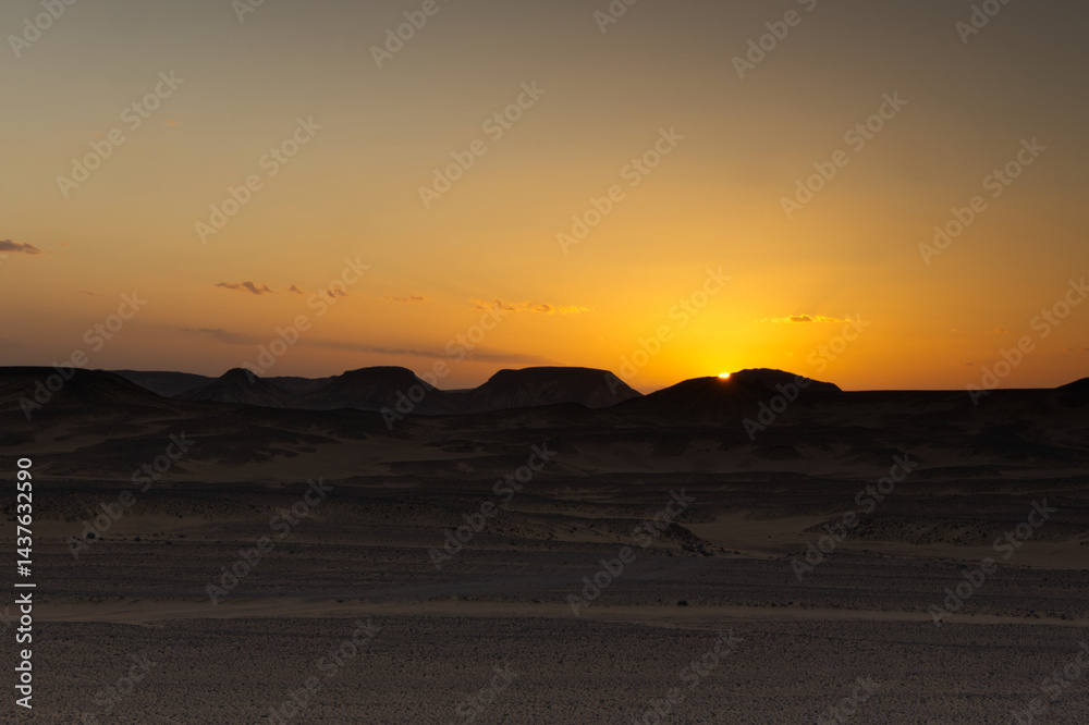 Sunset lights on the black desert in Egypt