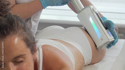 Female client enjoying a rejuvenating hardware slimming body treatment