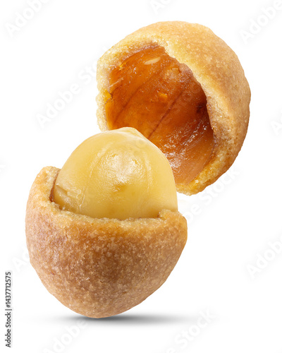 Two halves of a roasted peanut coated with a textured, light brown coconut-flavored layer, revealing the peanut inside.