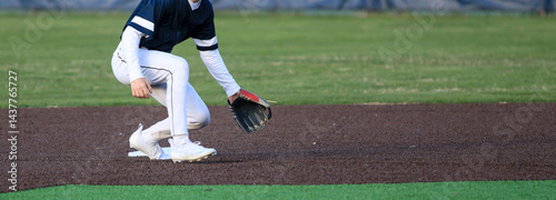 Baseball infielder making a play on the ball