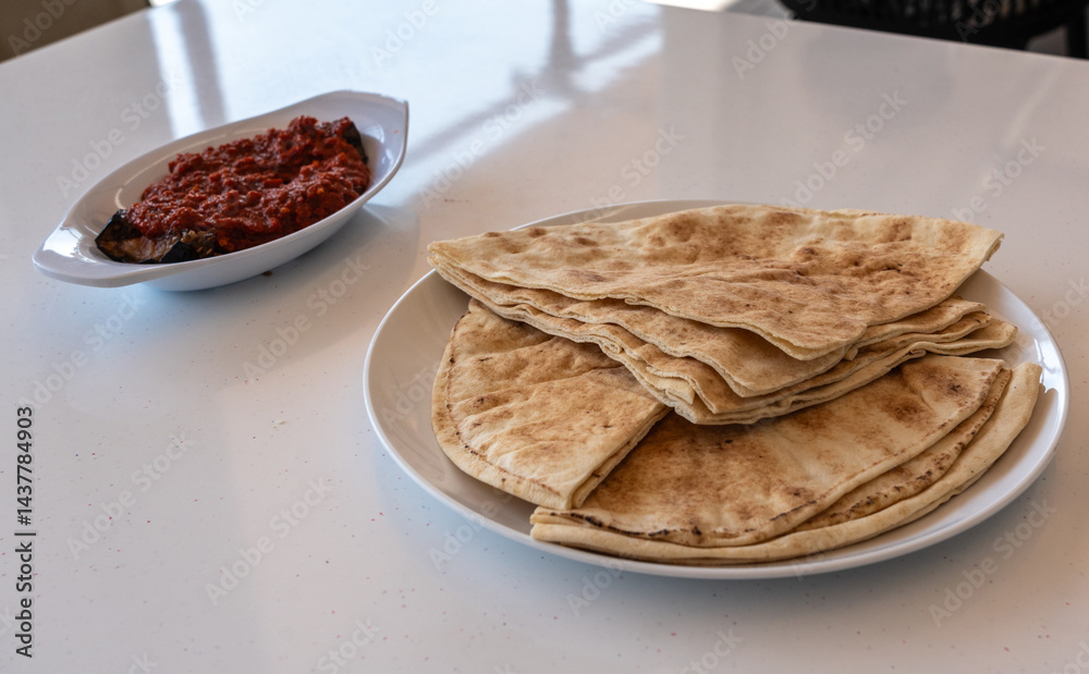 Traditional flatbread, lavash, wheaten pita flat bread or flatbread also known as pita bread