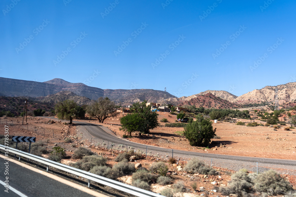 Morocco semi-deserts and mountains, north africa nature, Moroccan stone desert, red hills, villages and argan trees