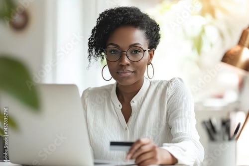 A determined woman sits at her desk, ready to complete an online purchase.