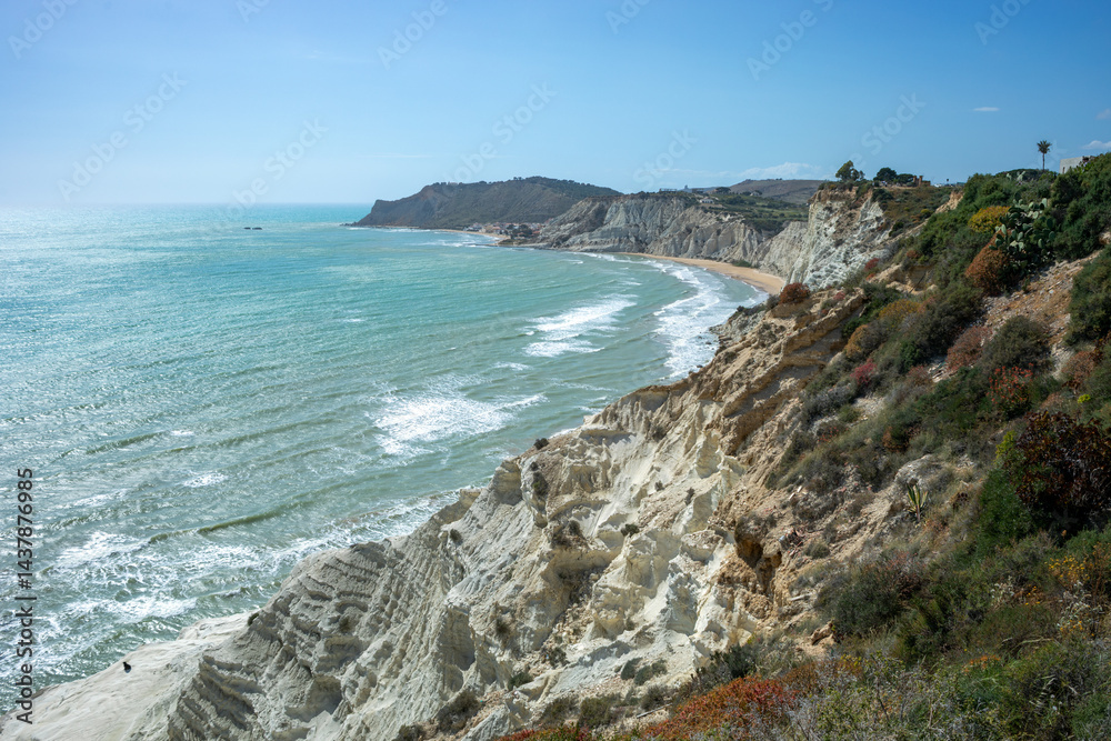 Scala dei Turchi beach in Agrigento, Sicily, Italy, with the blue Mediterranean and its famous white rock in the background from the top of the cliff