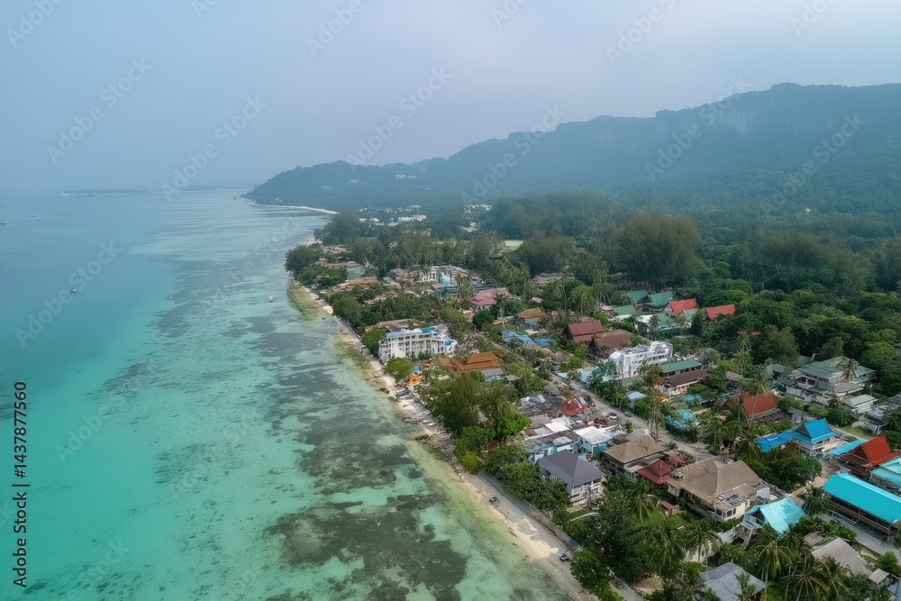 Naklejka premium Coastal town nestled beside turquoise waters and lush mountains