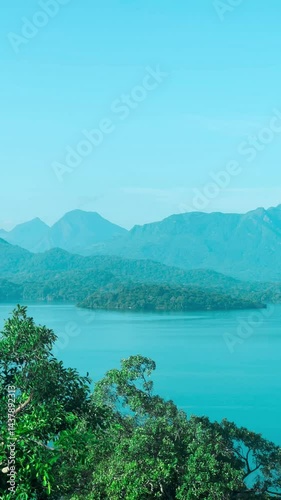 A calm view of Moragahakanda Lake surrounded by nature in Sri Lanka. summer season. 