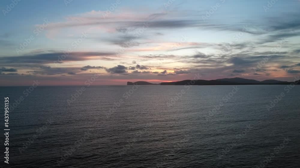 Drone Flight at Dusk Over a Cape, Capturing the Ocean and Clouds