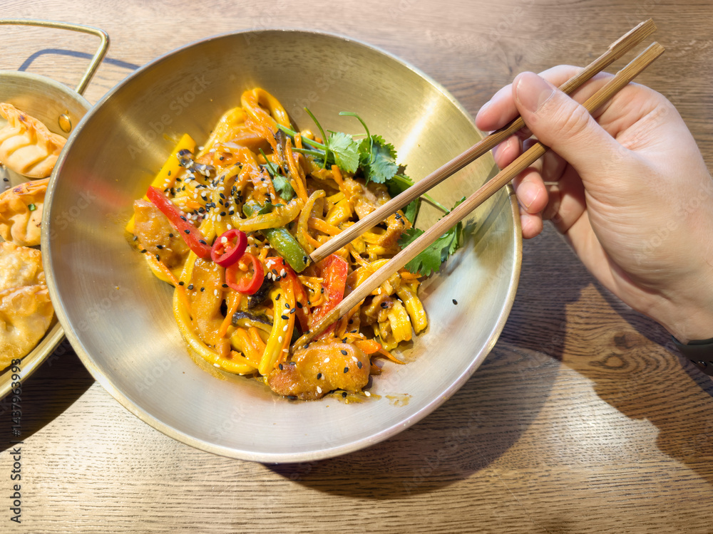 Trying national Asian cuisine in a restaurant