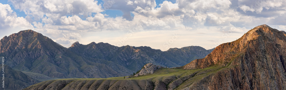 Fototapeta premium landscape with sunset light on rock mountains