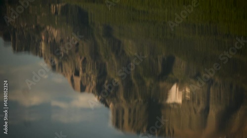 Reflection of Mountain in Rippling Water of Bowman Lake in Glacier National Park