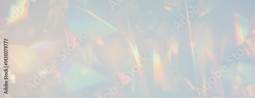 Abstract blurred crystalline visual effect with vibrant rainbow refractions and scattered particles on transparent background