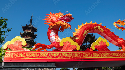 Photography Red dragon and Longhua temple pagoda in bue sky, Shanghai, China