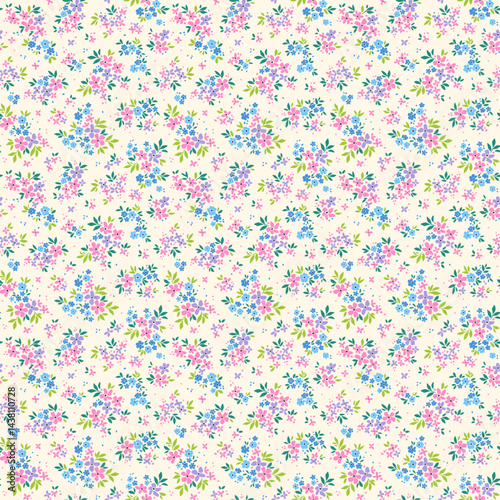 Beautiful cute floral pattern in small bright flowers. Small lilac, pink and blue flowers. Ivory cream background. Ditsy print. Floral seamless background. Gentle template for fashion prints. Stock