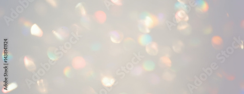 Abstract scattered bokeh lights with sparkling pattern of overlapping circular, vibrant rainbow refractions on transparent background