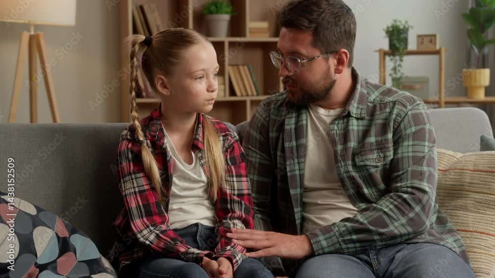 Caring Caucasian father man talking to kid girl conversation at home family care loving daddy parent touching little schoolgirl male dad supporting child bonding daughter guy discussing school trouble