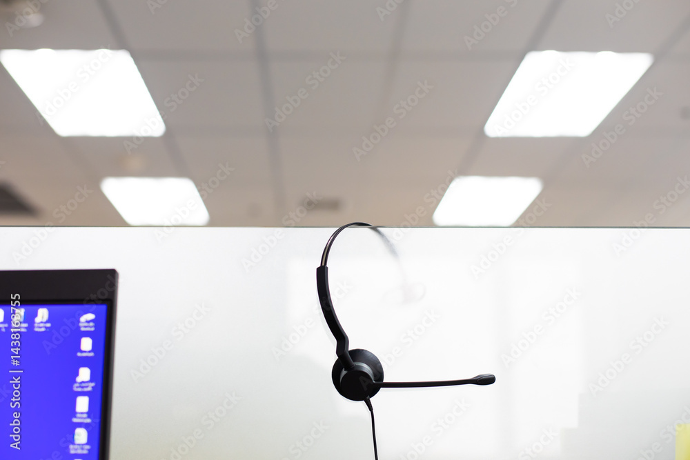 VOIP headset for callcenter on desk at customer service office. Communication support for sale support and telemaketing Helpdeskac