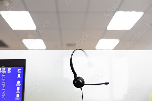 Obraz na płótnie VOIP headset for callcenter on desk at customer service office. Communication support for sale support and telemaketing Helpdeskac w salonie