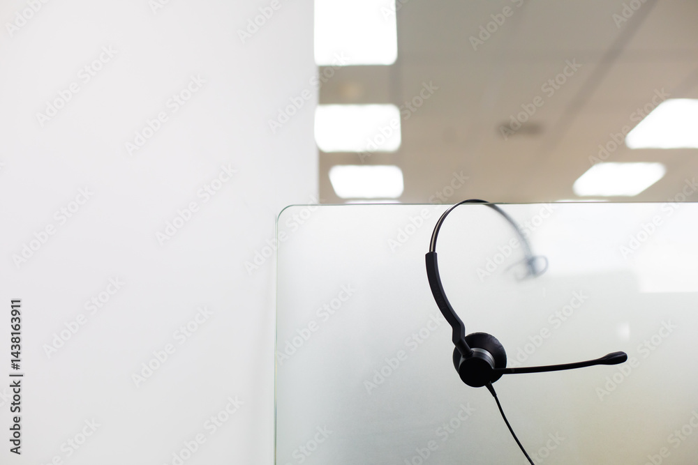 VOIP headset for callcenter on desk at customer service office. Communication support for sale support and telemaketing Helpdeskac