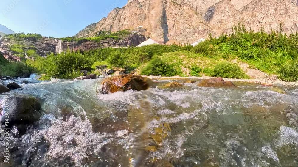 Underwater to view of Red Eagle Falls in Glacier National Park