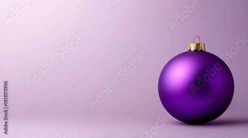 A purple christmas ornament on a purple background