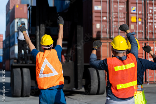 Obraz na płótnie Strike of workers in container yard. Group of multiethnic engineer people during a protest in workplace w salonie