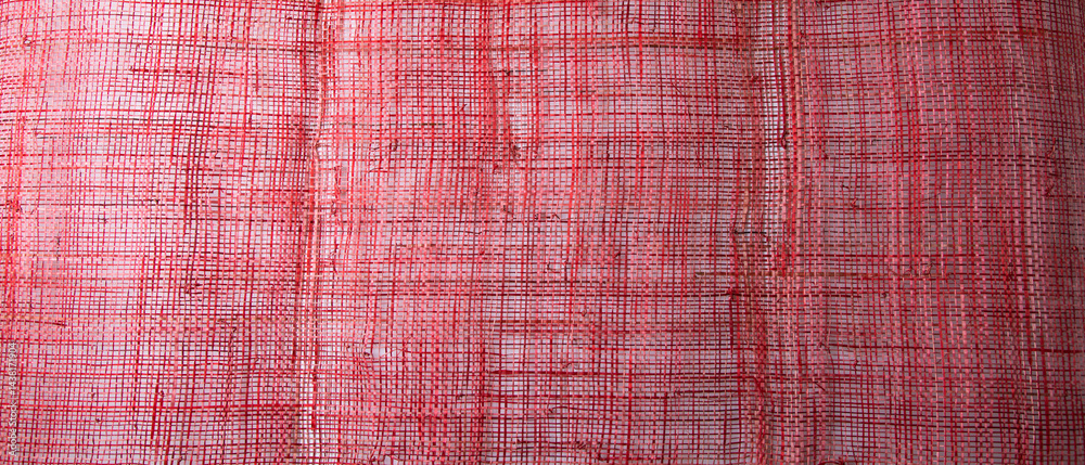 Top view Background texture of red cotton woven fabric.
