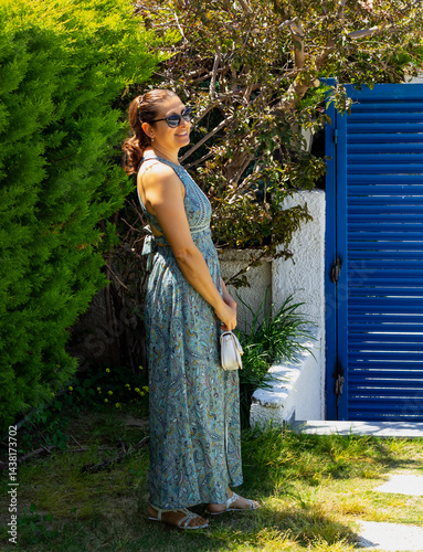 portrait of beautiful young woman in sunglasses in the garden