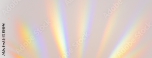 Soft radiating light rays emanating upwards with prominent vibrant rainbow colours from light refraction on transparent background