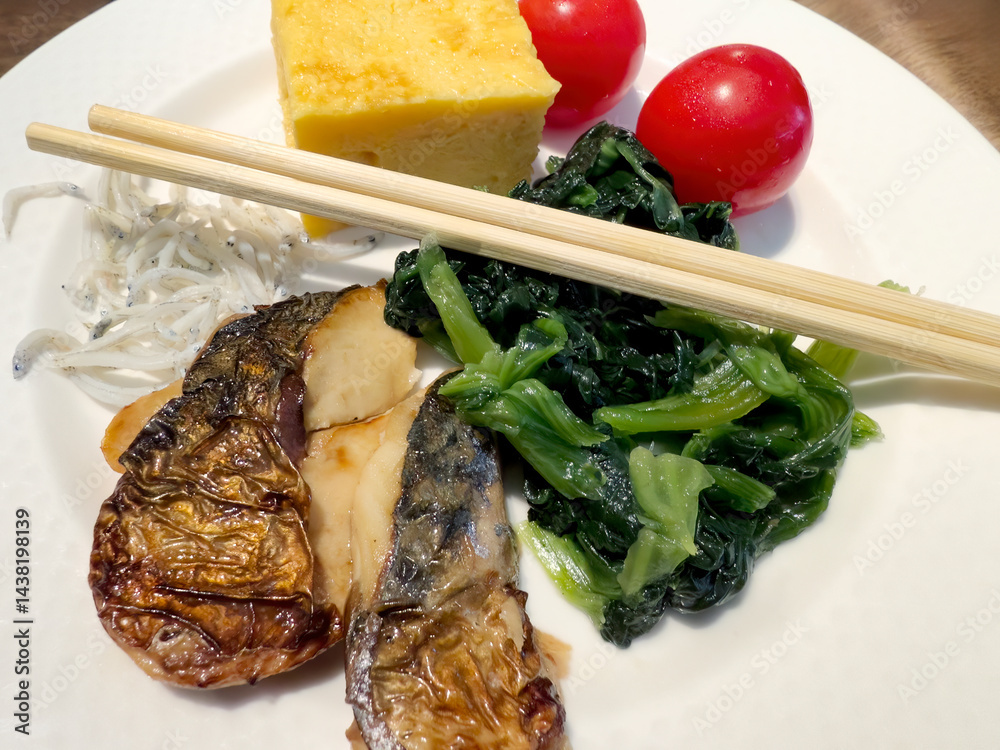 Close up view of Asian fish dish and various other vegetables