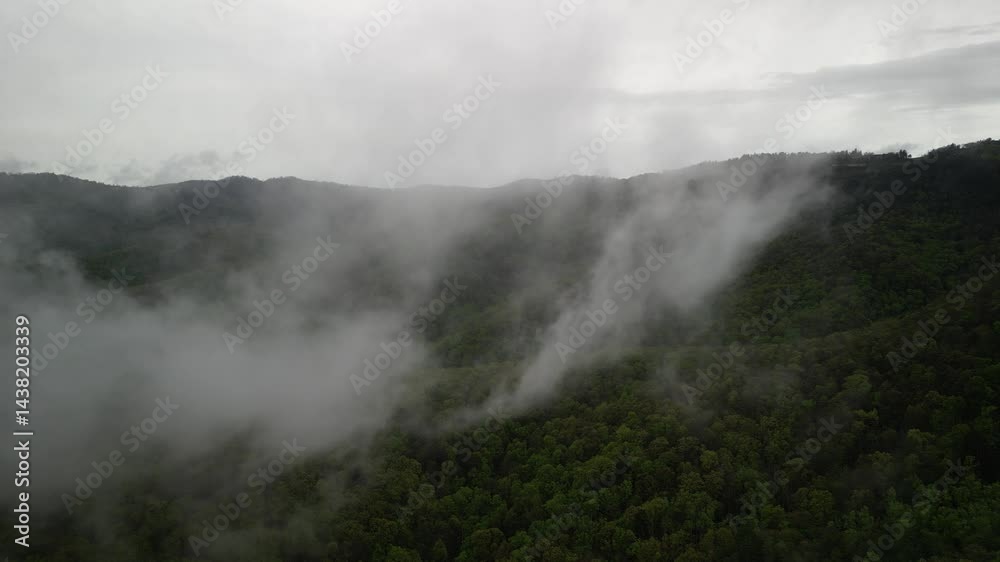 Aerial through low clouds above Southern Appalachian Mountains in North Carolina Aerial through low clouds above Southern Appalachian Mountains in North Carolina