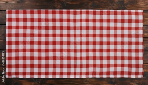 Red and white checkered tablecloth on a wooden table