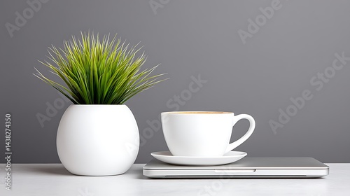 Wallpaper Mural Minimalist setup plant, coffee cup, laptop. Clean white aesthetic against a grey background Torontodigital.ca