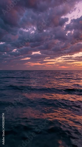 Vertical shot - sunset ocean drone flyover