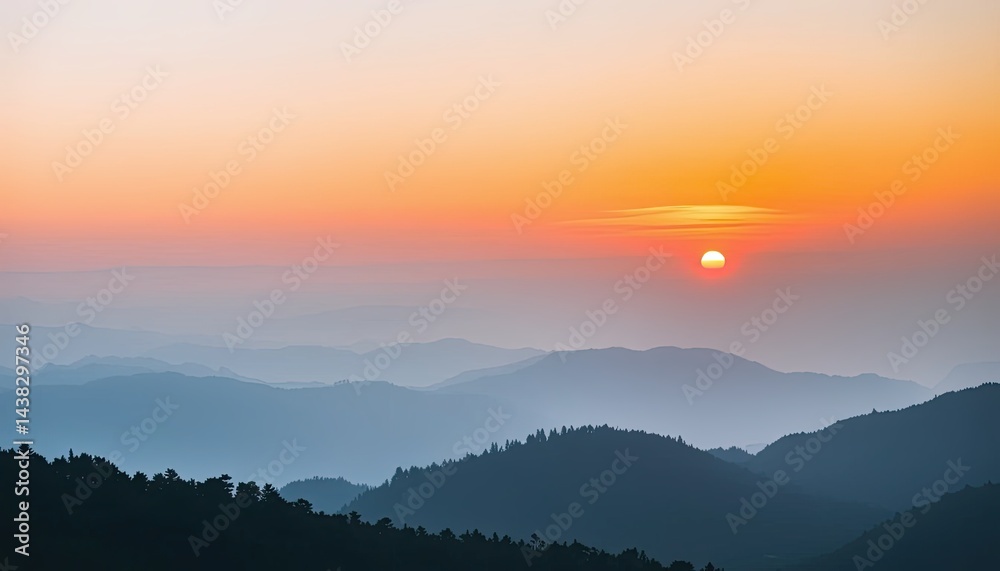Obraz premium Orange and Blue Sunset over Misty Mountain Range