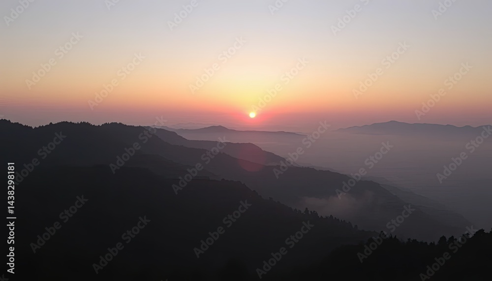 Obraz premium Sunrise Over Misty Mountain Range
