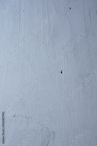 Textured blue wall with visible scratches and cracks