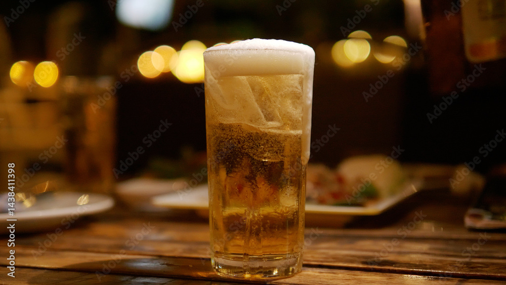 Beer glass on the table alcoholic beverage social party activity and relaxation at night golden drink