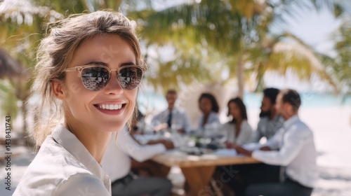Caucasian young female smiling at beach meeting with colleagues in tropical setting