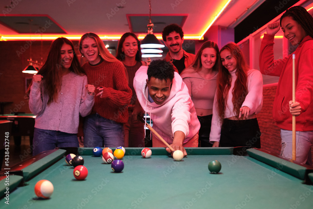 Group of friends enjoying a night out, playing pool and having fun in a vibrant bar
